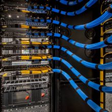 Fiber Optic and Cat 6 wiring in a server room. Fiber Optic and Cat 6 wiring in a server room.